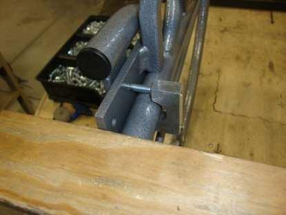 4 Place a wheelchair clamp around the inside of the lower side rail between the