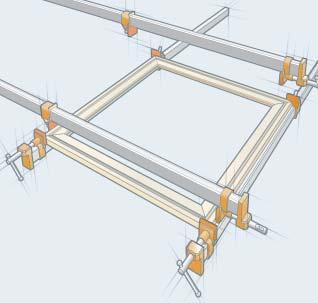 two side frame pieces into bar clamps, and apply light clamping pressure to the tips of the miters.