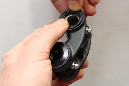 6. f) Apply a small dab of grease to the protruding part of the bearing caps and install all of them into the seals.