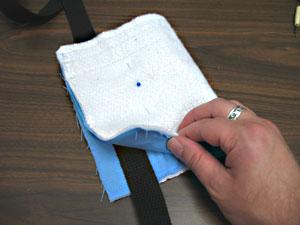 Sew the straps in place by sewing a 1/8 inch seamed box around the ends of the straps.