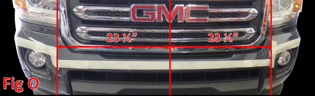 The first step is to find the center line of the valance. We did this by following the split of the M in the GMC grill logo down to the valance with a straight edge.