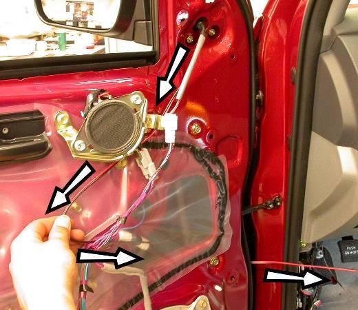 Guide all wire harnesses thru the hole in the door frame and position the mirror housing assembly onto the mirror mount.
