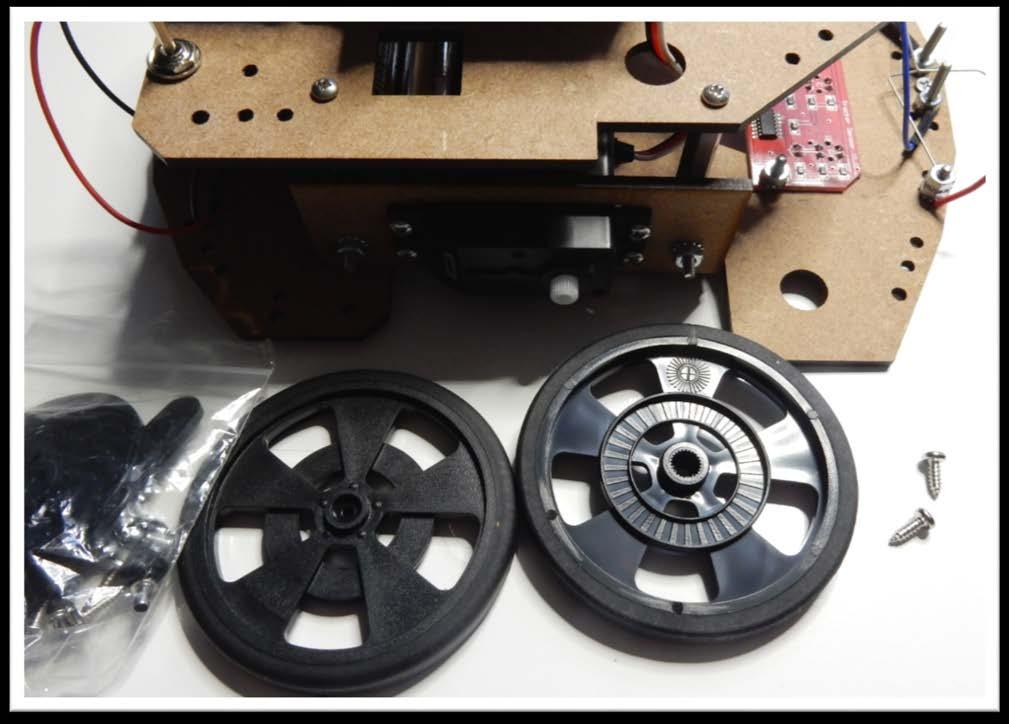 Step 8: Assembling the wheels Parts: - (2) wheels - (2) screws from servo motors parts
