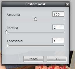 To sharpen a picture you should actually use the unsharp mask tool found under the Filter menu. When you select this filter you will get a dialog box.