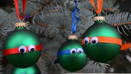 Cut 2 of ribbon and secure with hot glue on the back of the letter TMNT Ornaments Green ornaments Googly eyes Ribbon: purple, blue, red, orange Scissors Hot glue gun 1.