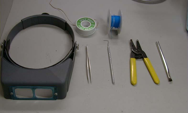 clock-wise from left: 4X magnifying headset, solder wick, wire