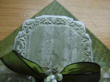 finish on green paper. Lift the embossing by using the chic moss gilding wax over the area.