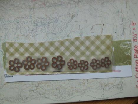 holes will be covered with flowers. The only issue will be threading the ribbon will take extra work.