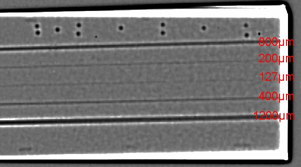 The object covers 1/3 of the pixels only. Fig. 14: Digital radiograph of a test wedge (5mm to 40mm Aluminium) with longitudinal drilled cross-bore holes of different diameters.