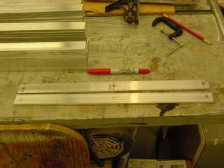 With the finished bar as a template, place it on each of the remaining bars and with a fine tip marker draw each of the holes for drilling.