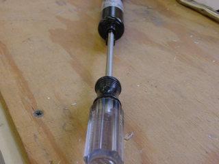 Now place the closer in a vice and with a hack saw first saw about 3/16 of an
