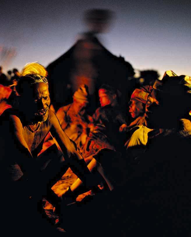 Here s a fantastic shot of Bushman tribespeople in Namibia, gathering by the fire for a night of ritual dancing. The image feels alive.