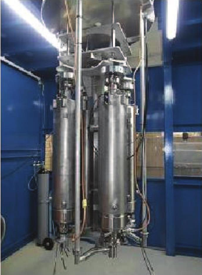 A set of four TESLA-type cavities installed in a prototype insert of a vertical cryostat is shown in Fig. 2.