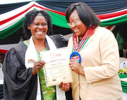 Zahara Amri, a Malindi entrepreneur receives her certificate from Coast