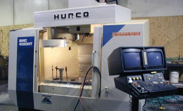 Automatic Tool Changers FIGURE 4-18 A vertical spindle machining center
