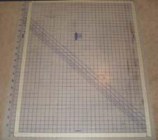 If available, tape a rectangle 30 x 40 on a cutting mat to use as a guide for the quilt top placement and alignment.