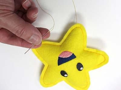 Using needle and thread, sew the opening closed by stitching along the original tack down seam.