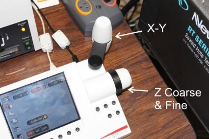 The Microscope Controller Control of Stage Movement Manual x, y and z stage control is via the knobs attached to the microscope controller, or by the manual X-Y stage