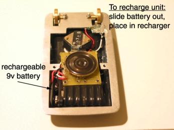 Recharging the battery To recharge the battery in your comm., unscrew the 2 bottom screws from the comm. bottom half.