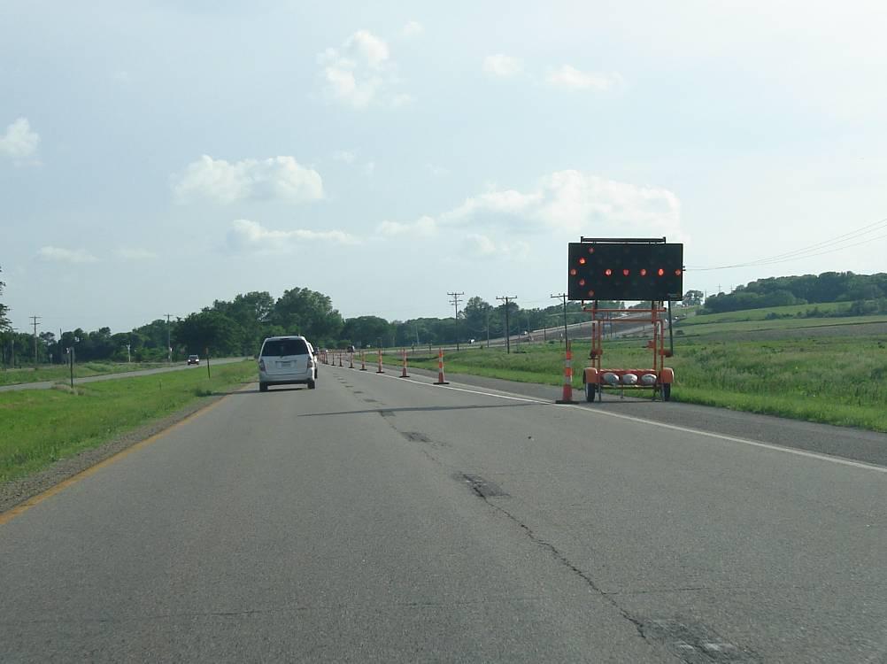 INTRODUCTION In work zones where the traffic control plans are relatively static, such as at long-term work zones, the use of a single advance warning arrow display, as shown in Figures 1 and 2, to