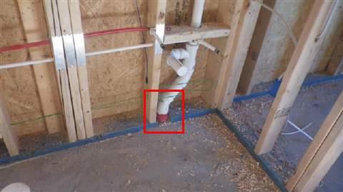 5) A protective plate is missing where the PVC drain pipe goes