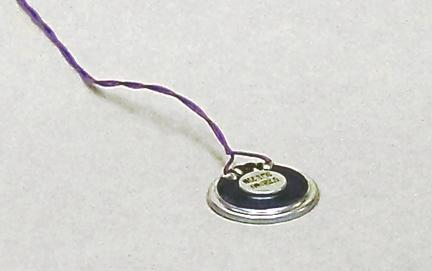 Clip off each end of the small RF capacitors mounted on the motor leads.