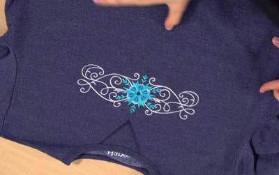 And here's the finished result: a sparkling snowflake sweatshirt, ready to add a warm and cozy look to your winter wardrobe.