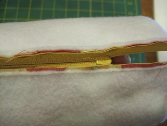 Align the fabric so that the zipper edge is even with