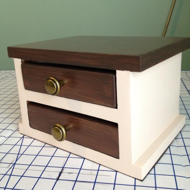 Drawers are lined in felt and have felt covered bottoms to glide smoothly