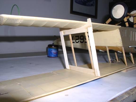 Blocking up the tail post the appropriate amount helps to hold everything in place. Make sure the fuselage sides are square to the wing center section.