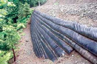 The U.S. Forest Service first used gravity-reinforced soil walls in the 1970s to stabilize logging roads. Photo credit: NCHRP Synthesis 430, 2012.