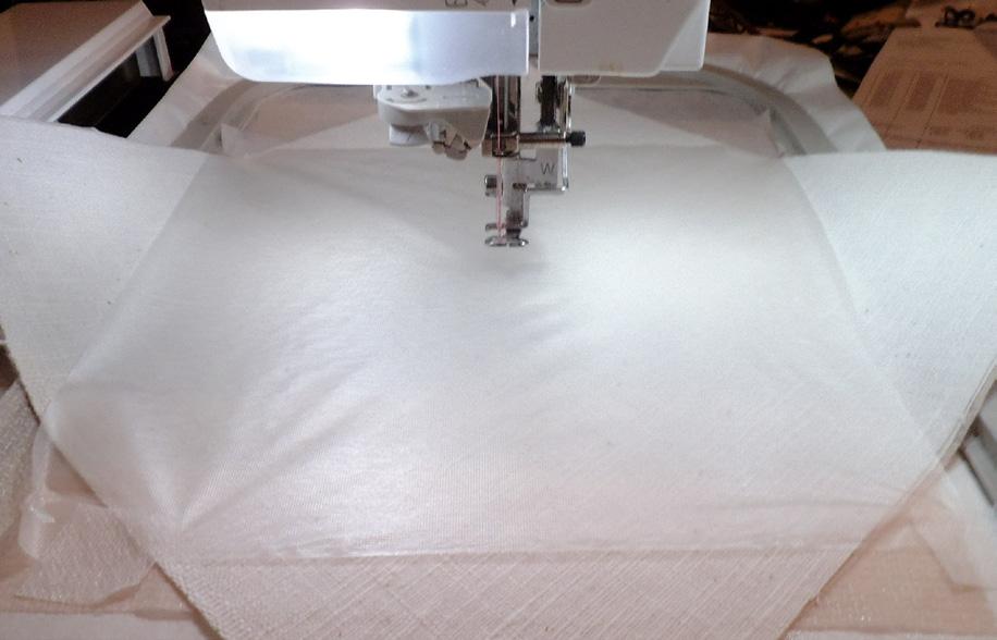 Gently remove the printed template from the fabric. Cover the design area with a piece of Water Soluble Topper.