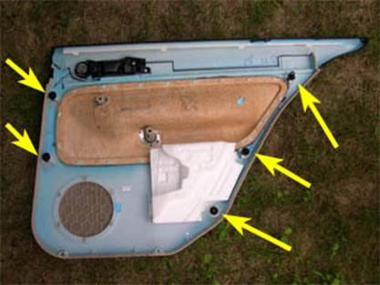 9. Starting with the top, rear corner, pull the door panel up and out of the window seal, as shown below.