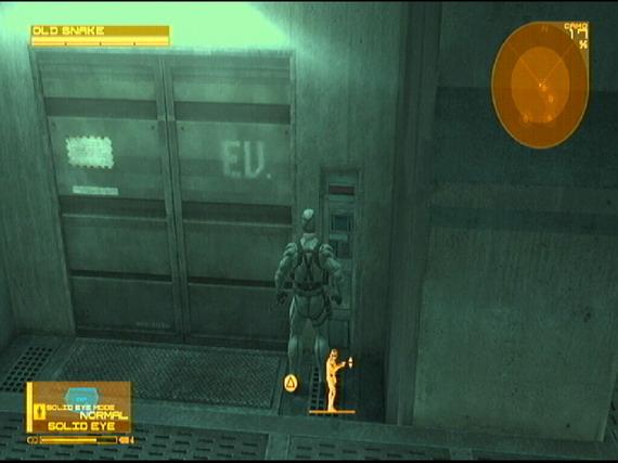 Use the elevator up the stairs to reach level B2. Before heading down, look on the catwalk to the left for a ration. Go down the ramp and crawl inside to receive a call from Otacon.