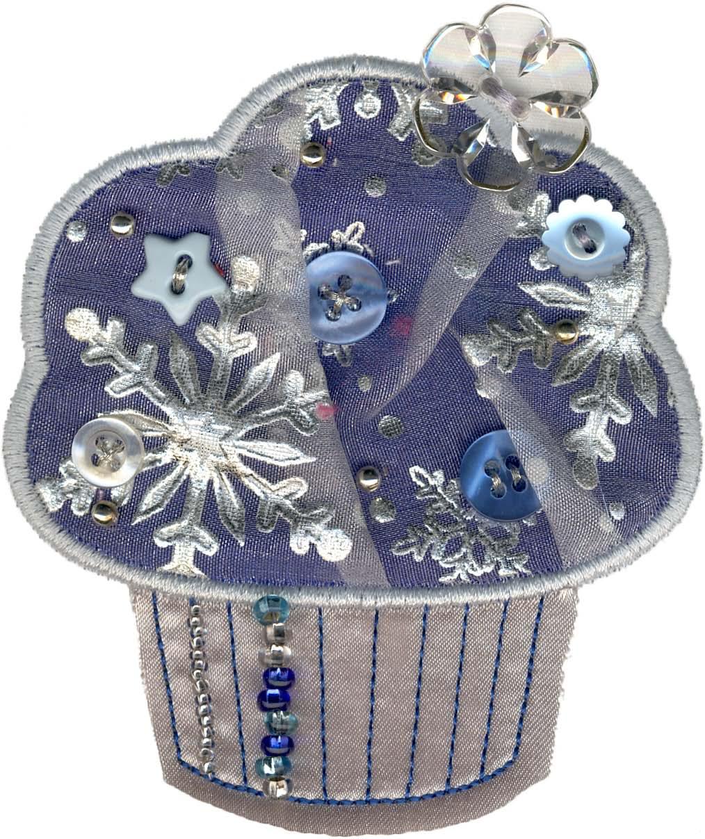 12397-07 Winter Cupcake Cute as a Cupcake Additional embellishments used: Large clear flower button, an assortment of light blue & white buttons, & silver, clear, & blue beads attached by hand.