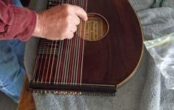 As soon as they came, I started stringing up the zither and tuning it.