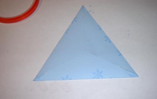 Step Twelve: Fold flap with attached triangle (image down) over the