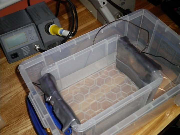 Place your acid bath inside a larger container which has a sealable lid for