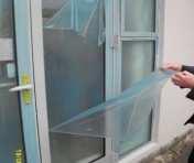 Applied by ShieldIt technician Short-term window protection Lay UV-stable adhesive film to glass and frames.