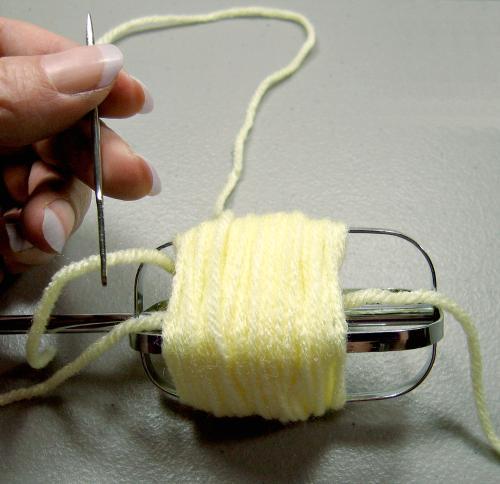 I thread my yarn needle to do this.