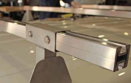 Slide the 75" crossbars through openings of each of the left and right roof rack mounts so that they protrude an even distance outside