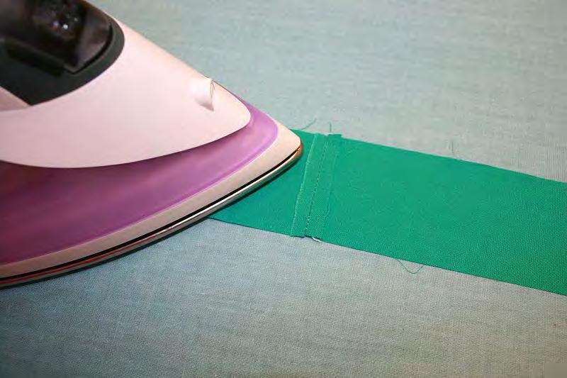 put it in the center. Sew the edges together and then iron the seams flat.