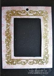 Lift up frame and tap off excess glitter. Repeat along outer edge of frame and allow to dry. Repeat on reverse side of the ornament.