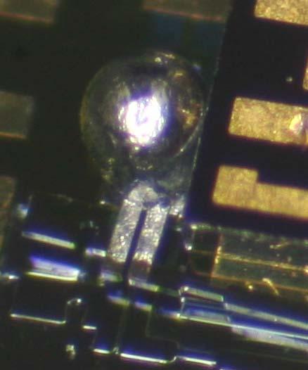Solder lock of MEMS structure 1) On chip heater melts solder ball 2) MEMS moves the lens into optimal position.
