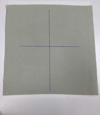 Mark the center horizontal and vertical position of the square with a water-soluble marker. 3.
