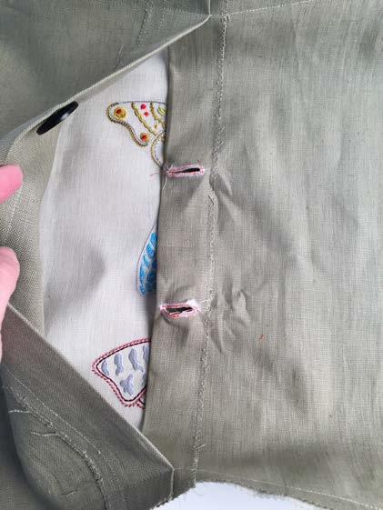Using a button sew-on foot, stitch a button at each of the marked