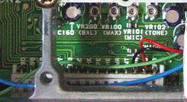 This photo shows the interface points for the Audio/COR board. The small via near the corner of the microprocessor IC (IC4) is the discriminator audio pick-off point.