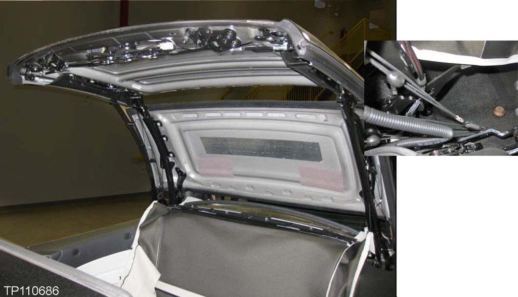 16. Next, drop down the headlining and lay out on the rear back seat to access the rear rib (see Figure 15). Refer to the Electronic Service Manual (ESM) as needed.