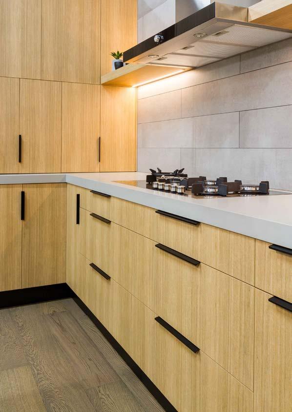 FRONT AND BACK COVER: Natural Style kitchen features rear and overhead cabinetry in Laminex Impressions textured surfaces Sublime Teak Riven finish.