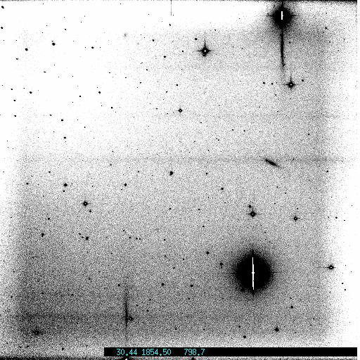 The CCD was only being cooled to -75 C as opposed to -100 C due to an error in the software. Upon cooling the CCD to the appropriate temperature, the large scale structure and streaks disappeared.